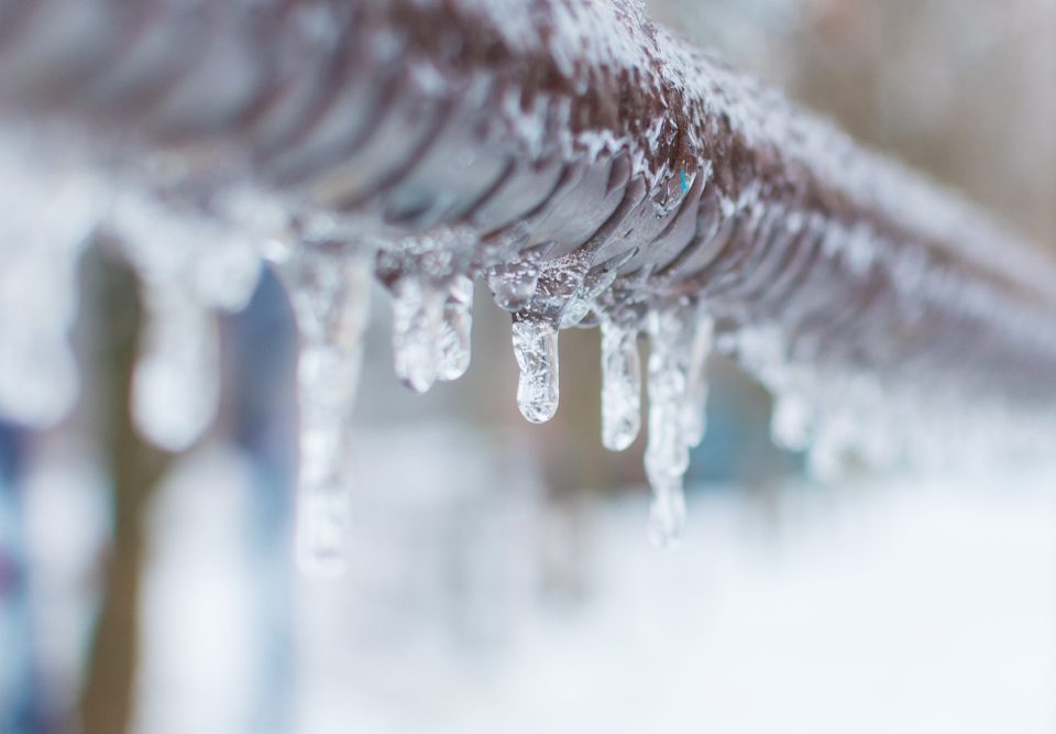 Frozen Icicles On a Pipe